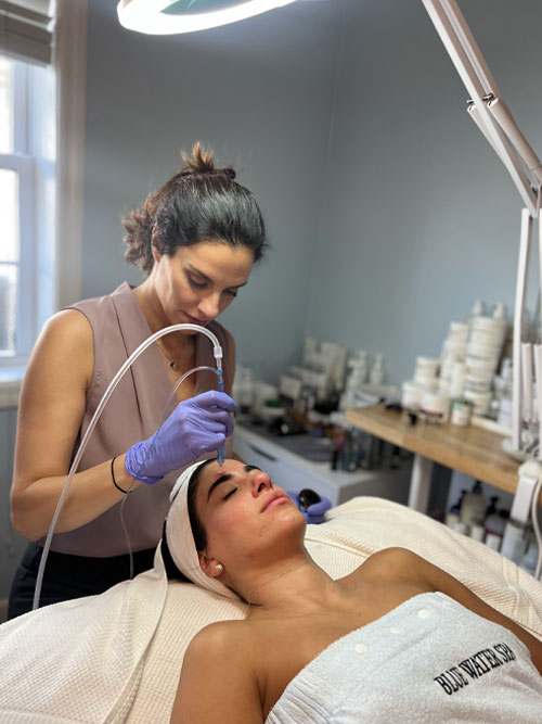 A photo of Rachel Lozina doing a Jet Peel Facial treatment at Blue Water Spa ... [08a655]