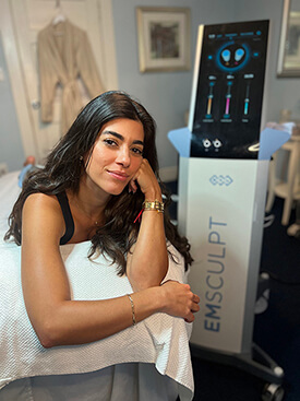 Beautiful young woman smiling while being treated at Blue Water Spa with Emsc... [8cef89]